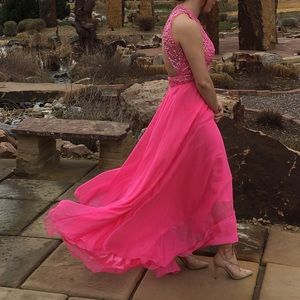 A pink bedazzled long prom dress